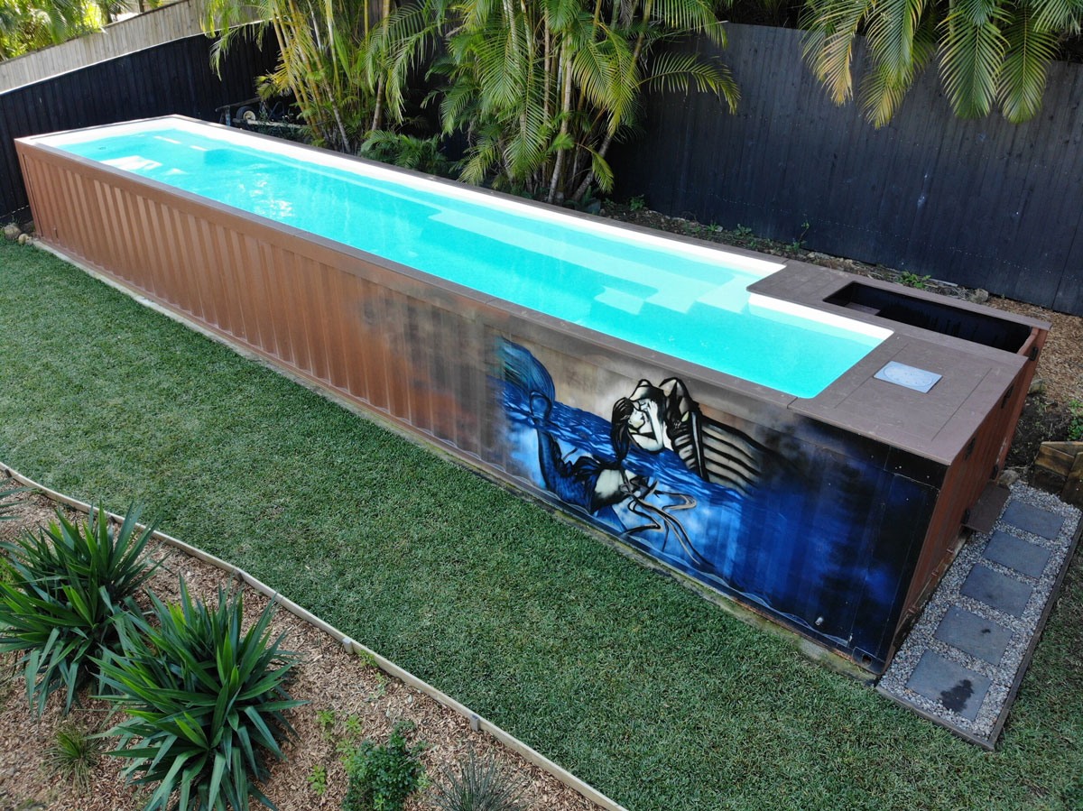 A container pool with a custom external display in a backyard. Source: Shipping Container Pools